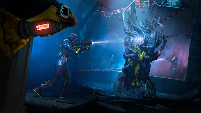 A soldier looks on as their team mate is stuck in a strange goop in Rainbow Six Extraction