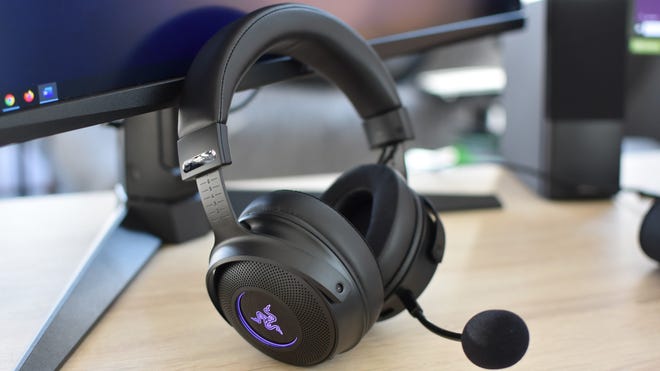 The Razer Kraken V3 Pro gaming headset propped up against a monitor.