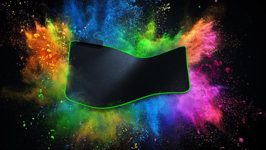 a photo of a razer goliathus desk-sized mouse pad, with colour exploding behind it