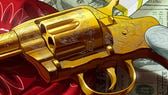 A close-up of the golden Double-Action Revolver which is available in Red Dead Redemption 2 and GTA Online.