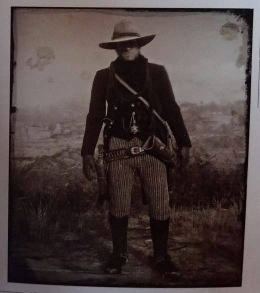 A black and white picture of the Legend of the East outfit in Red Dead Redemption 2.