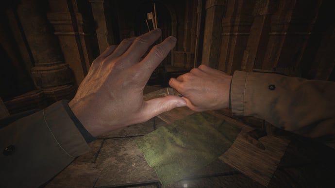 Ethan holds up both hands to the screen thanks to a new hand mod in Resident Evil Village
