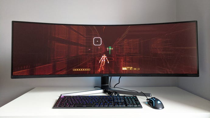 A photo of an ultrawide gaming monitor running Rez Infinite