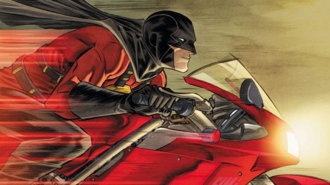 An image of Tim Drake in Red Robin costume on motorbike