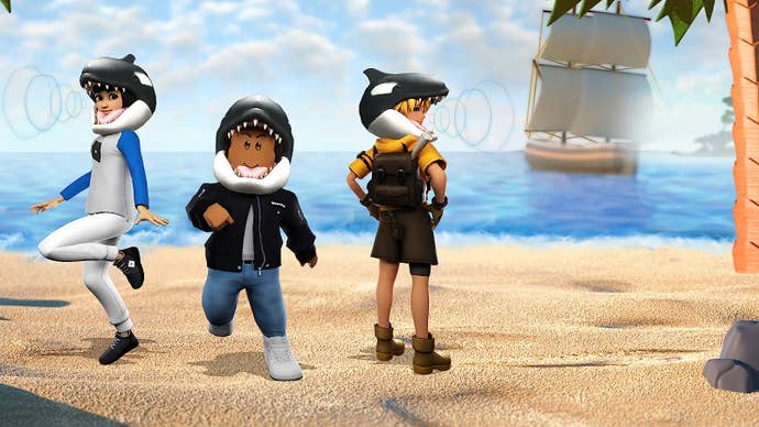 Ein Strand mit drei Roblox -Charakteren stand darauf, wach trug den hungrigen Orca -Hut