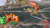 An image of some clay versions of meeples for Root