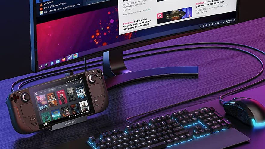a photo of a steam deck with keyboard, mouse and monitor attached. the monitor is showing Steam and the website rockpapershotgun.com.