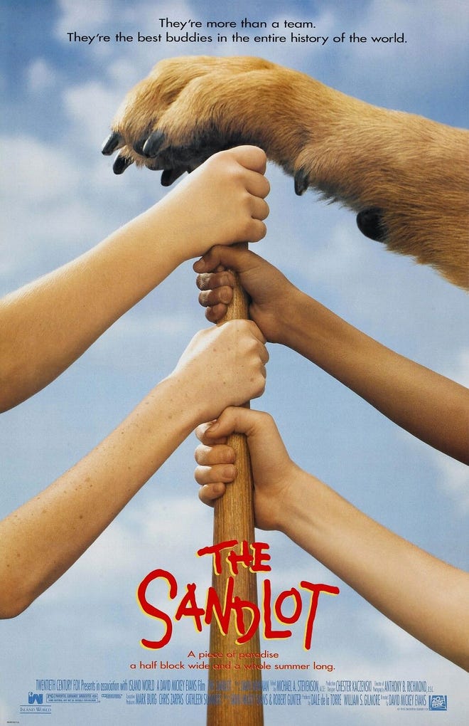 Poster for The Sandlot, featuring boy's hands on a bat with a dogs paw on top