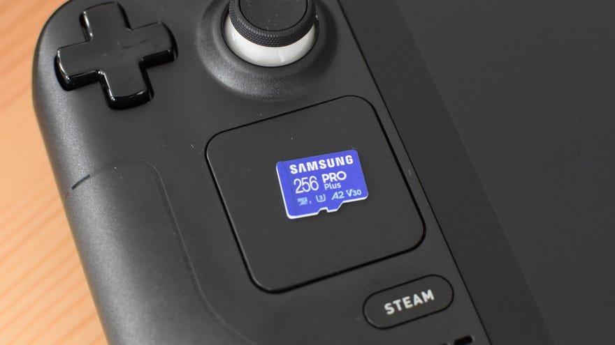 A Samsung Pro Plus microSD card on top of a Steam Deck.