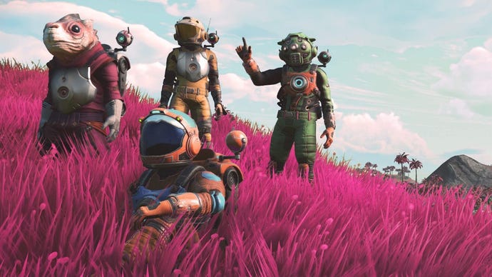 No Man's Sky - Four space suit-wearing characters stand and sit together in tall, pink grass looking up into the sky.