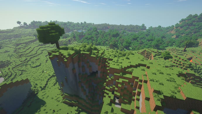 A Minecraft cliff, with a tree on the very edge of the cliff.