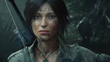 Lara Croft staring at the camera with a weary but determined look.