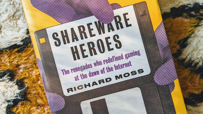 The book cover for Shareware Heroes, showing a floppy disk being grabbed at by four, stylised purple hands. The background is a lovely yellow.