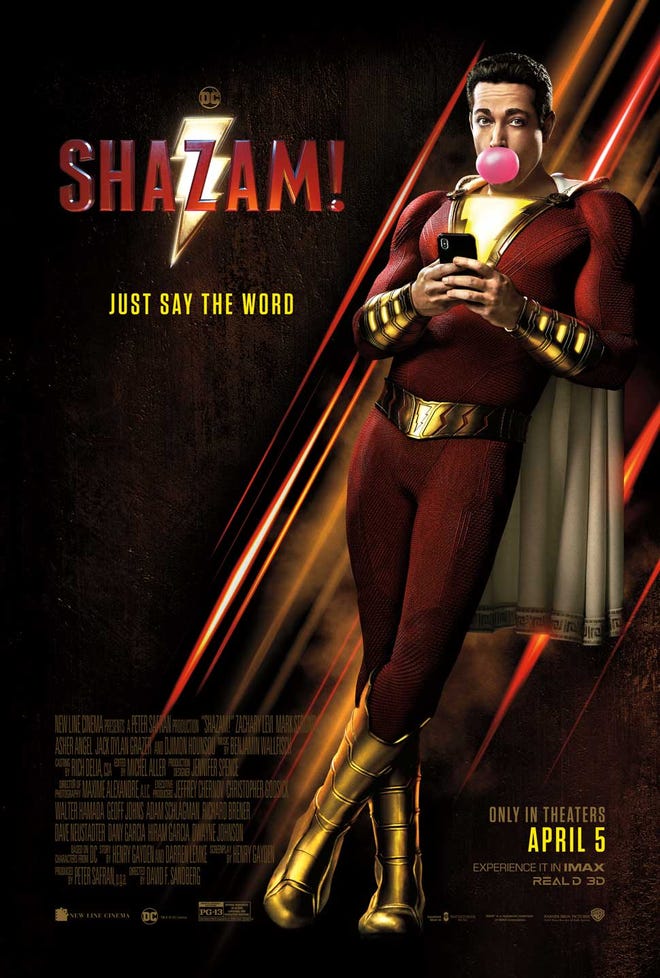 Shazam! movie poster, Zachary Levi as Shazam blowing a pink bubblegum bubble, typing on his phone while leaning against the side of the poster