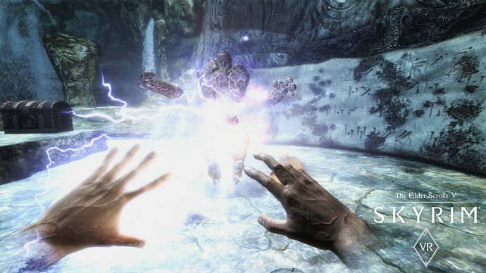 A player looks at their hands while facing an enemy in The Elder Scrolls V Skyrim VR