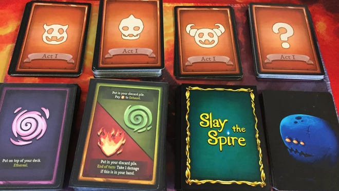 An image of some cards for Slay the Spire: The Board Game.