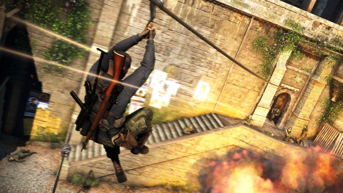 A screenshot of Sniper Elite 5 showing the player ziplining over an explosion and directly towards five or more firing Nazis.