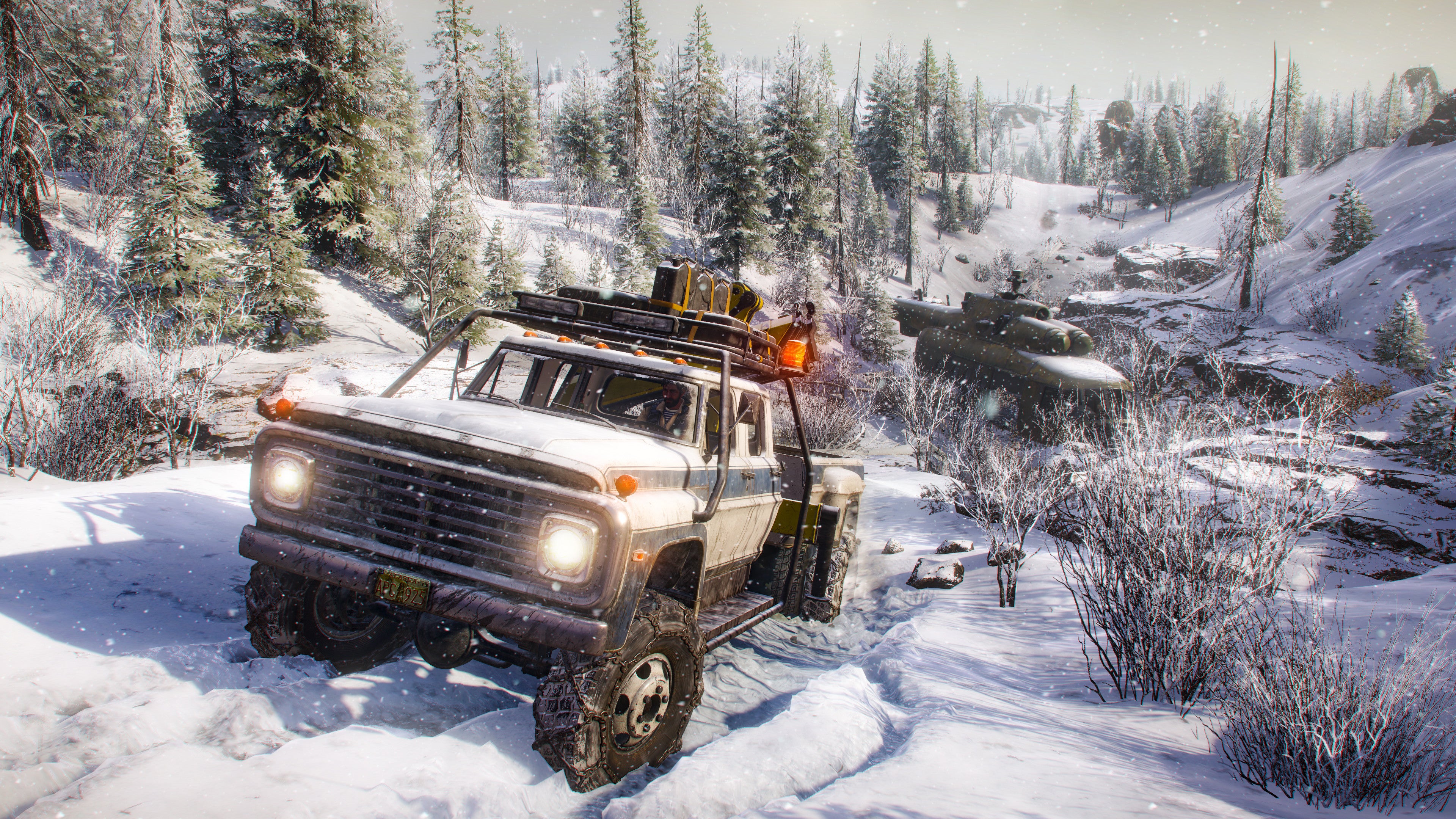 Driving through snow in a SnowRunner screenshot.