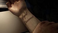 The protagonists terrible tattoo in Sons Of The Forest: script on the inside of his right wrist reading 'Fight Demons'