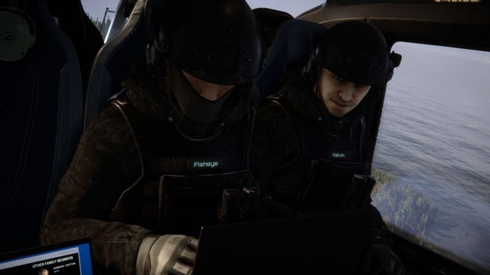 Kelvin, a soldier in black tactical gear, sits nest to another soldier with a covered face, in a helicopter flying over water