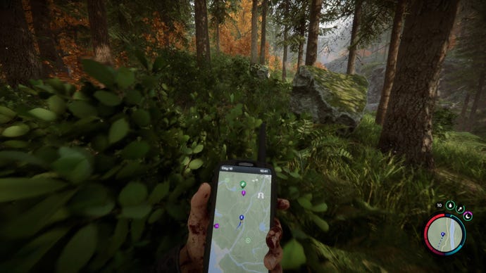 The player in Sons Of The Forest checks their GPS while running through the forest.