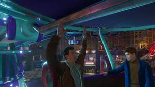 Peter Parker raises his arms in a cheer while riding a Ferris wheel next to Harry Osbourne. Peter's face is oddly devoid of emotion given the situation.