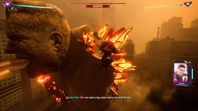 Marvel's Spider Man 2 screenshot showing a battle with a giant Sandman in New York surrounded by a sandstorm