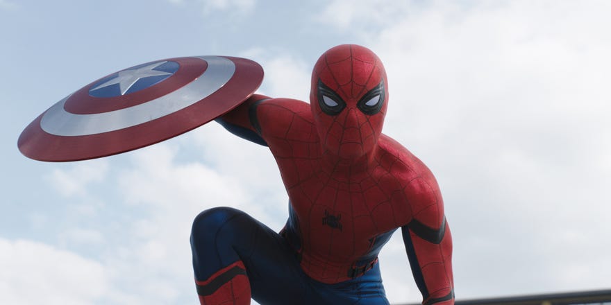 In a screencap from the film Captain America: Civil War, Spider-Man holds Captain America’s shield during his first appearance in his full costume in the MCU.