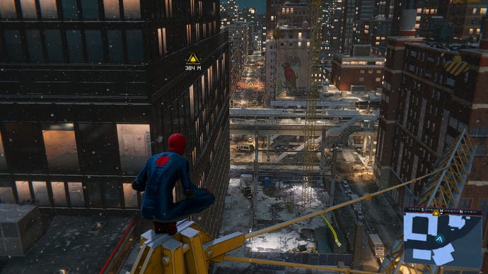 Miles Morales sits on a crane and looks out over a snowy New York in Marvel's Spider-Man: Miles Morales