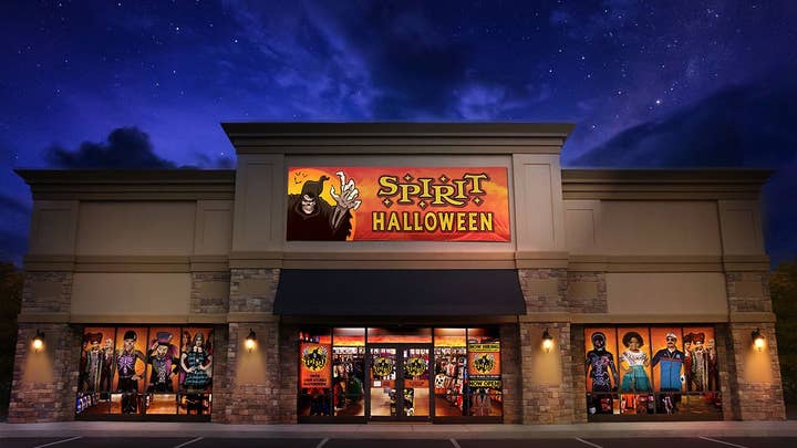 A Spirit Halloween retail storefront with an ominous sky in the background