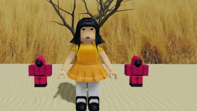 The Red Light Green Light game from Squid Game set up in Roblox. The focus of the picture is on a giant doll and two guards.