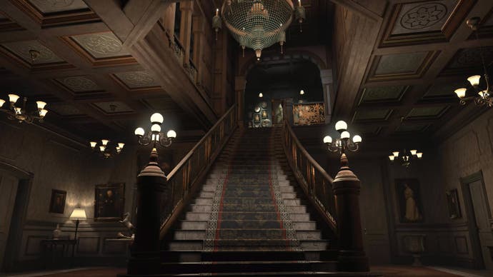 A screenshot of The 7th Guest VR showing Stauf Mansion's lavish entrance hall, its grand staircase stretching up into the gloom.