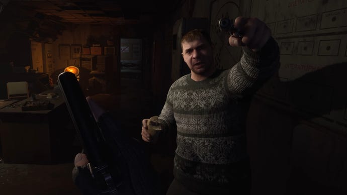 An NPC holds a gun to the player's head in a house in Stalker 2: Heart Of Chornobyl.