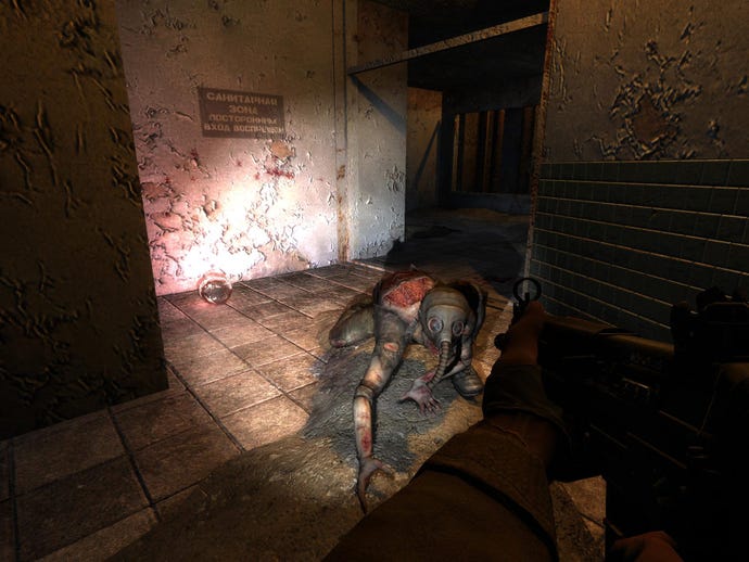 An anomaly in a gas mask crawls toward the player in STALKER: Shadow Of Chernobyl