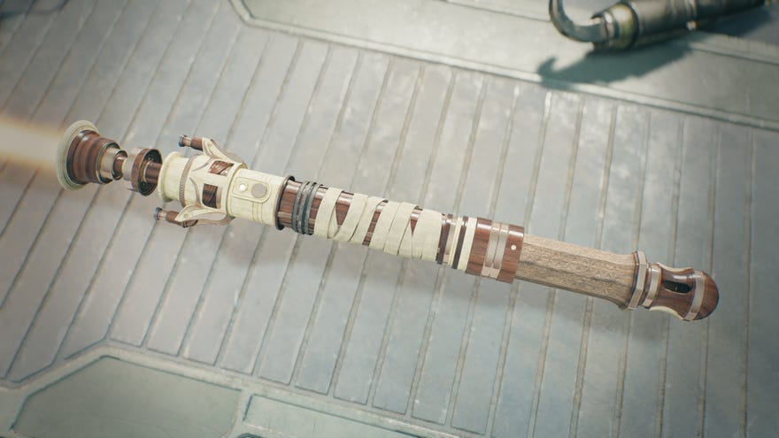 صورة مقربة من Lightsaber المخصص للاعب في Workbench of Jedi: Survivor. يصنع Lightsaber في المقام الأول من الخشب والعظام ، والرياضة والشفرة البرتقالية