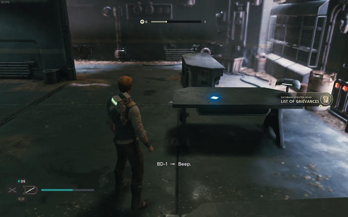 Cal scans a datapad on a table in Jedi: Survivor.