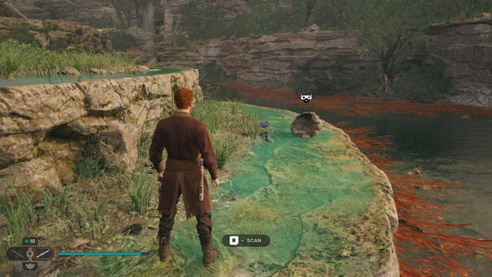 Cal scans a shell on the edge of a river in Jedi: Survivor.