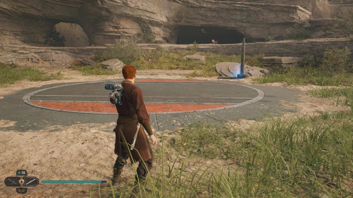 Cal stands in Rambler's Reach Outpost in Jedi: Survivor and looks at a Force Echo in front of him.