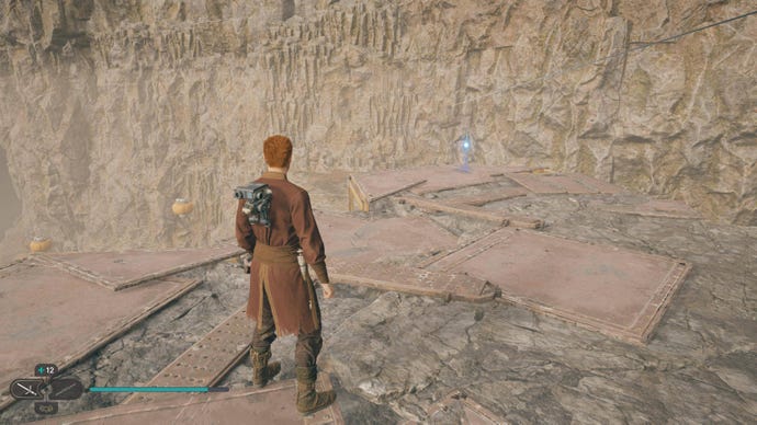 Cal approaches and picks up a collectible on Koboh in Jedi: Survivor.
