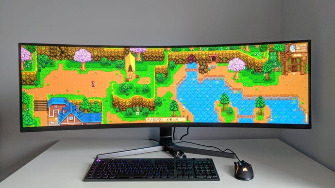 A photo of an ultrawide gaming monitor running Stardew Valley