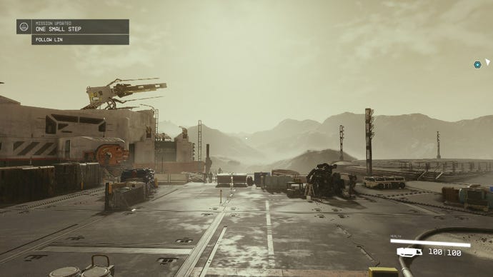 The first planetside sight you see in Starfield: a yellow-grey sky, grey mountains and a grey docking area