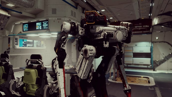 VASCO, a robot companion in Starfield, looks towards the camera while standing in the room of a spaceship.