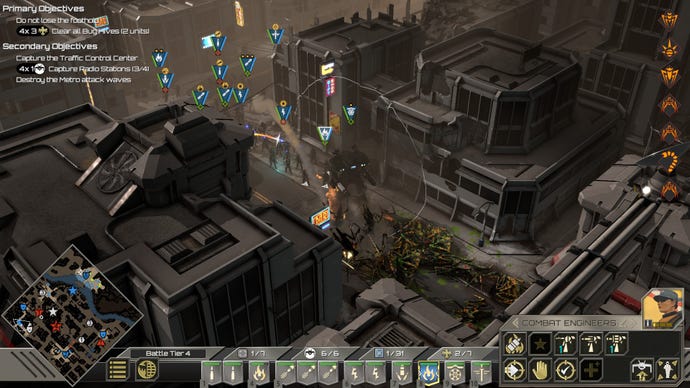 Some marines, with a large mech in front, fighting some bugs in a tight alley in a destroyed town in Starship Troopers: Terran Command