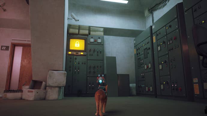 The cat of Stray looks at a computer tower.