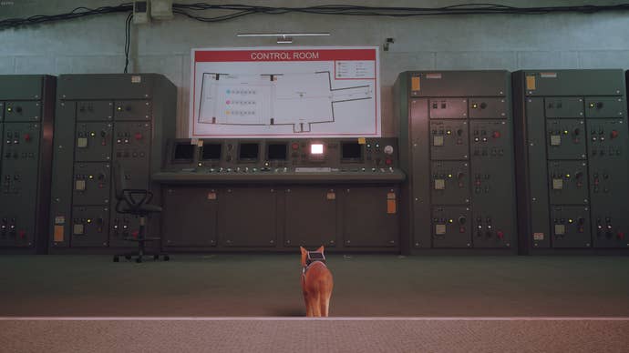 The cat of Stray faces the main computer in the Control Room.