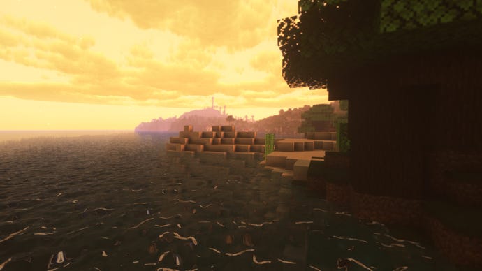 Een oranje hemel boven een kustscène in Minecraft