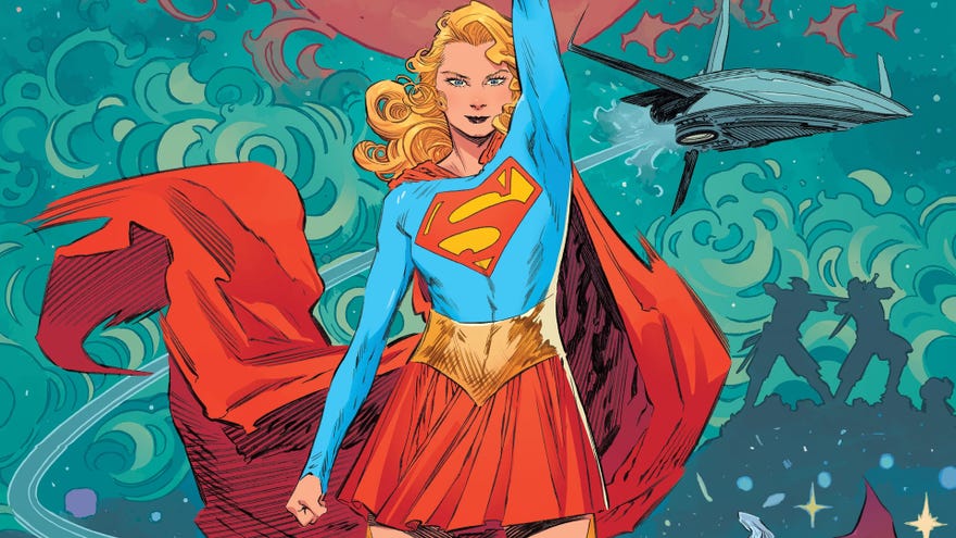 Supergirl stands with her arm raised