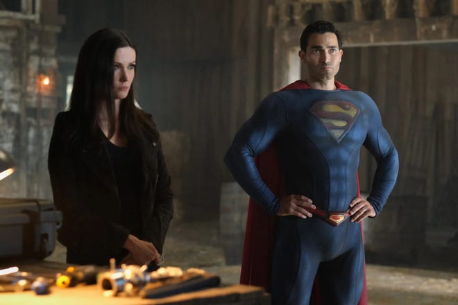 Lois and Superman stand together