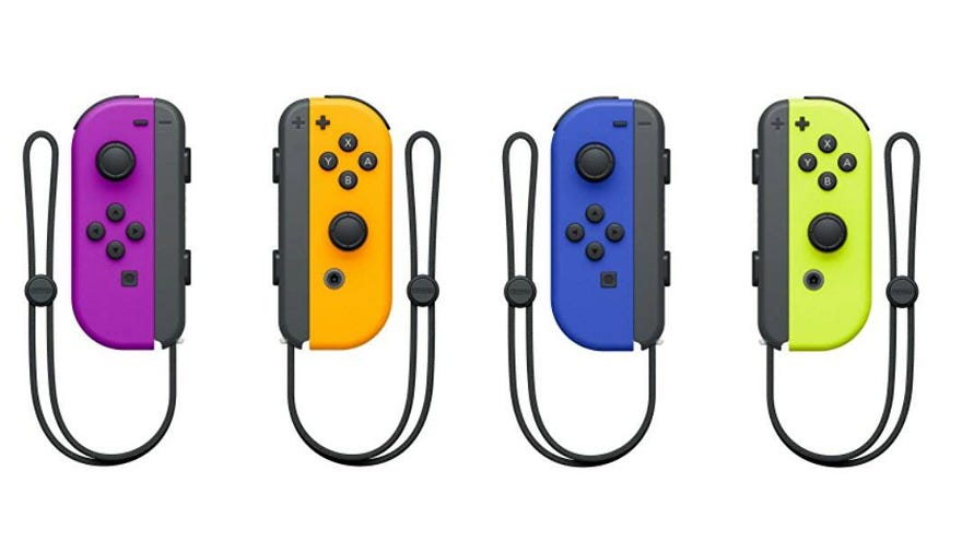 Multi-coloured Nintendo Joy Cons in a row.