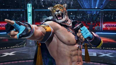 Image of Tekken 8 with the tiger-mask-wearing King in a wrestling ring pointing off-screen and holding a microphone labelled "King of the Iron Fist Tournament"